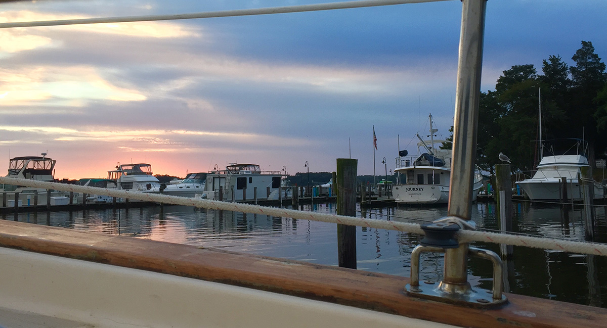Day One morning, sunrise over a marina