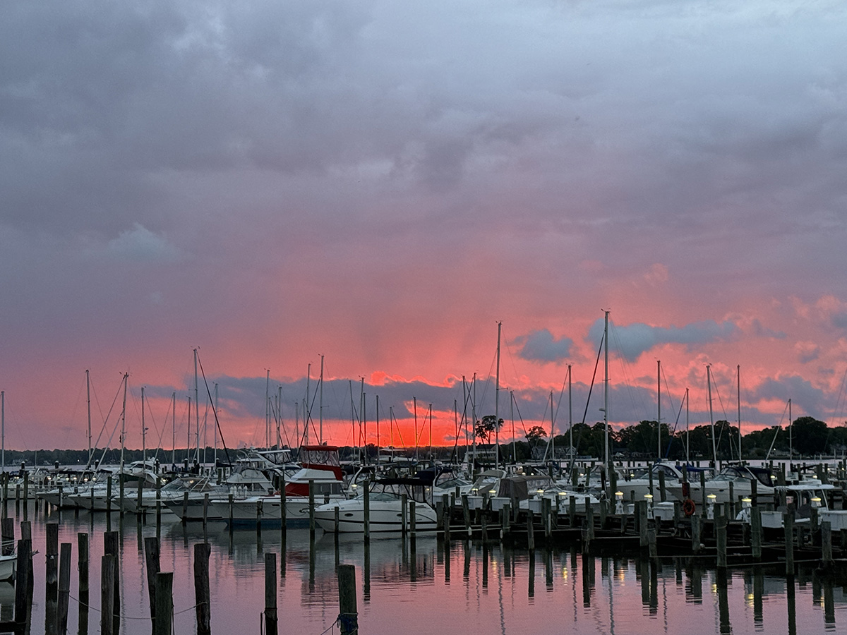 A red sky over a marina